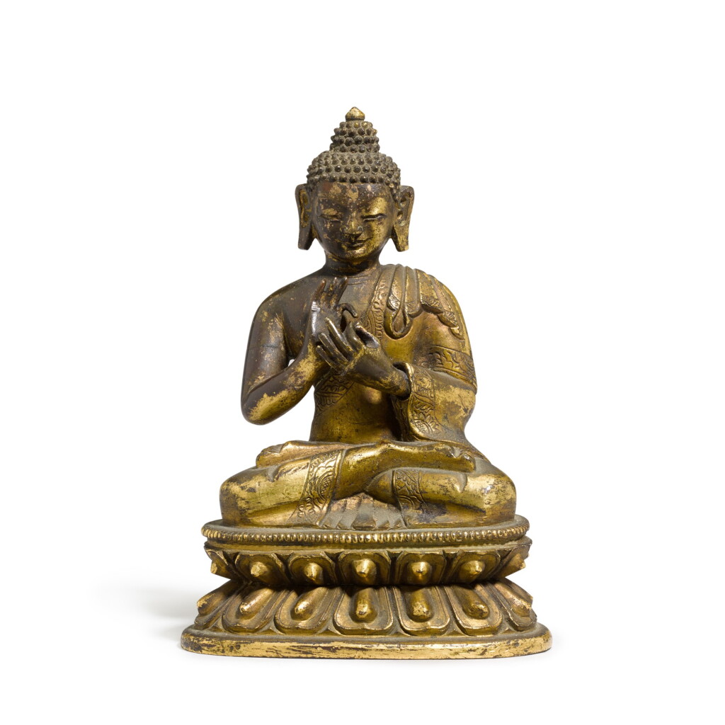 View full screen - View 1 of Lot 44. A gilt-bronze Buddha seated on a double lotus base 17th/18th century | 十七/十八世紀 鎏金銅佛像.