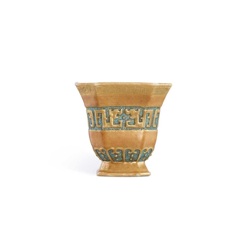 View full screen - View 1 of Lot 405. A rare gilt-decorated trompe l'oeil bronze-imitation archaistic 'chilong' square cup, Qing dynasty, 19th century 清十九世紀 瓷胎仿銅釉螭龍紋四方倭角盃.