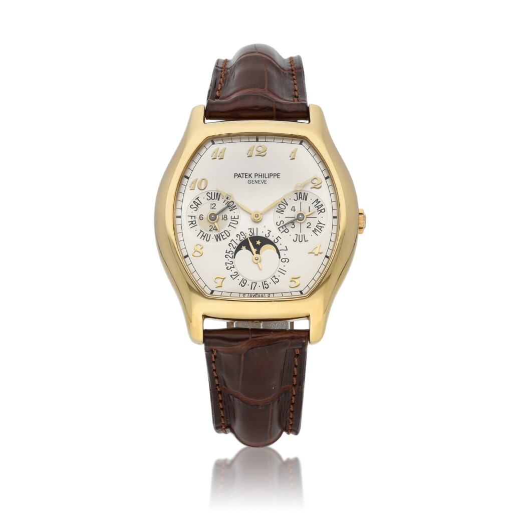 View full screen - View 1 of Lot 20. Ref. 5040 | A yellow gold tonneau-shaped perpetual calendar wristwatch with moon phases and 24-hour indication | Circa 1997.