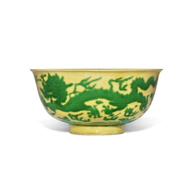 View full screen - View 1 of Lot 256. A yellow-ground green-enameled 'dragon' bowl, Mark and period of Kangxi.