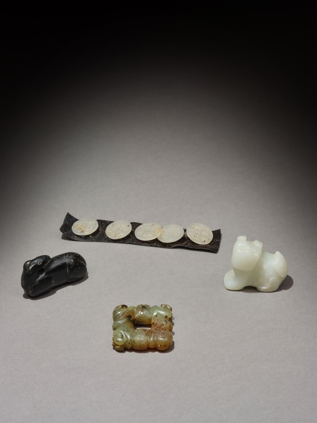 View full screen - View 1 of Lot 102. A group of four jade carvings, Ming / Qing dynasty | 明 / 清 玉雕一組四件.