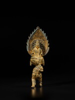 A gilt-bronze figure of Manjushri on a lion, Tang / Song dynasty