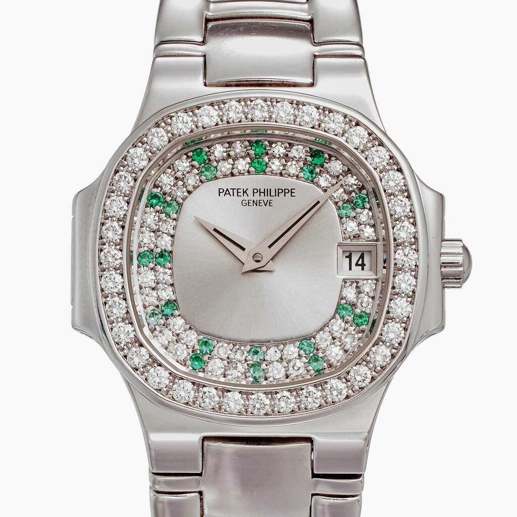 View full screen - View 1 of Lot 147. Reference 4700/153 Nautilus | A white gold, emerald, and diamond-set wristwatch with date and bracelet, Made in 2001.