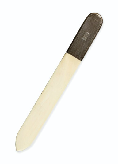 View full screen - View 1 of Lot 646. An ivory letter opener with silver-plated mounts monogrammed KL, probably English, circa 1930.