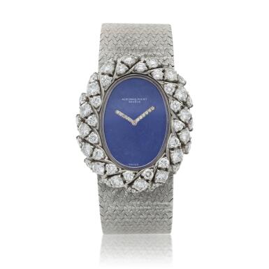 View full screen - View 1 of Lot 158. A white gold and diamond-set bracelet watch with lapis lazuli dial, Circa 1980.