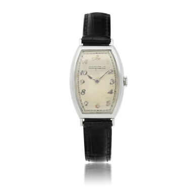 View full screen - View 1 of Lot 138. PATEK PHILIPPE | A WHITE GOLD TONNEAU-SHAPED WRISTWATCH CIRCA 1930 .