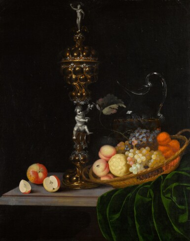 View full screen - View 1 of Lot 152. Still life with an elaborate silver gilt standing cup, a basket of fruit, and a glass wine jug upon a partly draped table.