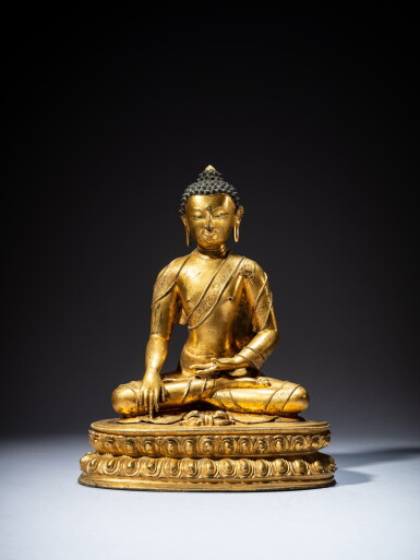 View full screen - View 1 of Lot 36. A gilt-copper alloy figure of Shakyamuni Buddha, Tibet, 15th century | 十五世紀 藏傳銅合金鎏金釋迦牟尼佛坐像.