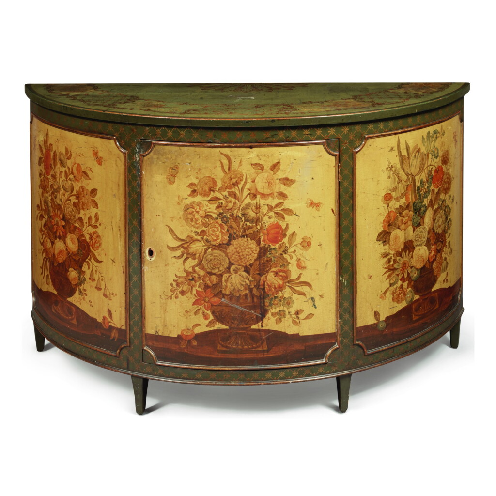 View full screen - View 1 of Lot 907. A GEORGE III STYLE CREAM, GREEN, AND POLYCHROME PAINTED DEMILUNE SIDE CABINET, EARLY 20TH CENTURY.