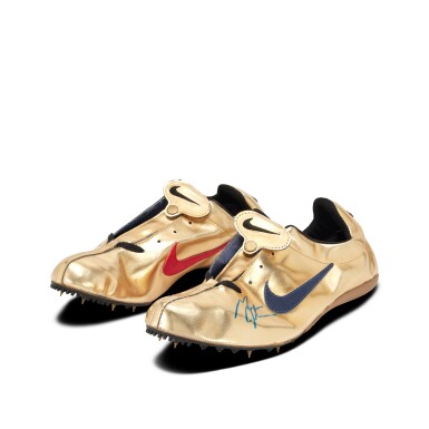 View full screen - View 1 of Lot 80. Michael Johnson Dual Signed | Nike ‘Gold Shoe’ Track Spikes.