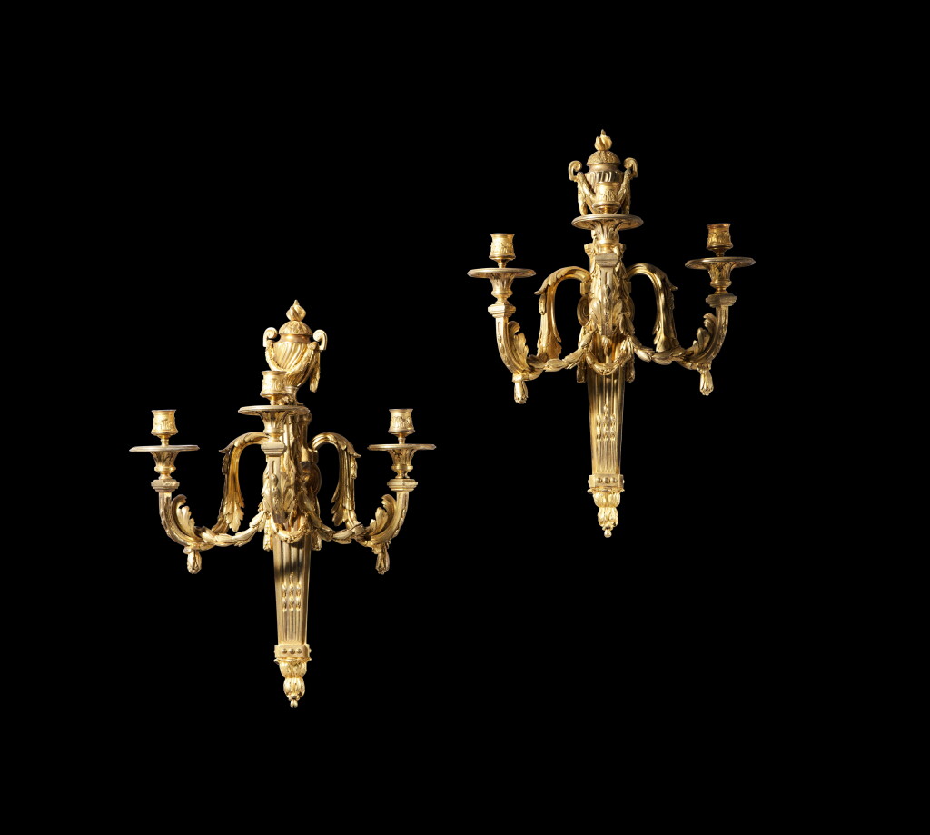View full screen - View 1 of Lot 229. A pair of gilt-bronze three-light wall lights, in Louis XVI style, second half 19th century Paire de grandes appliques au vase à trois lumières en bronze doré de style Louis XVI, seconde moitié du XIXe siècle.