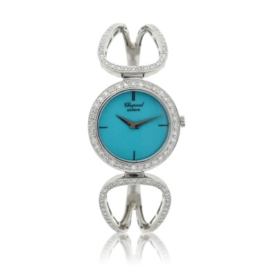 View full screen - View 1 of Lot 58. A white gold and diamond-set bangle watch, Circa 1990.