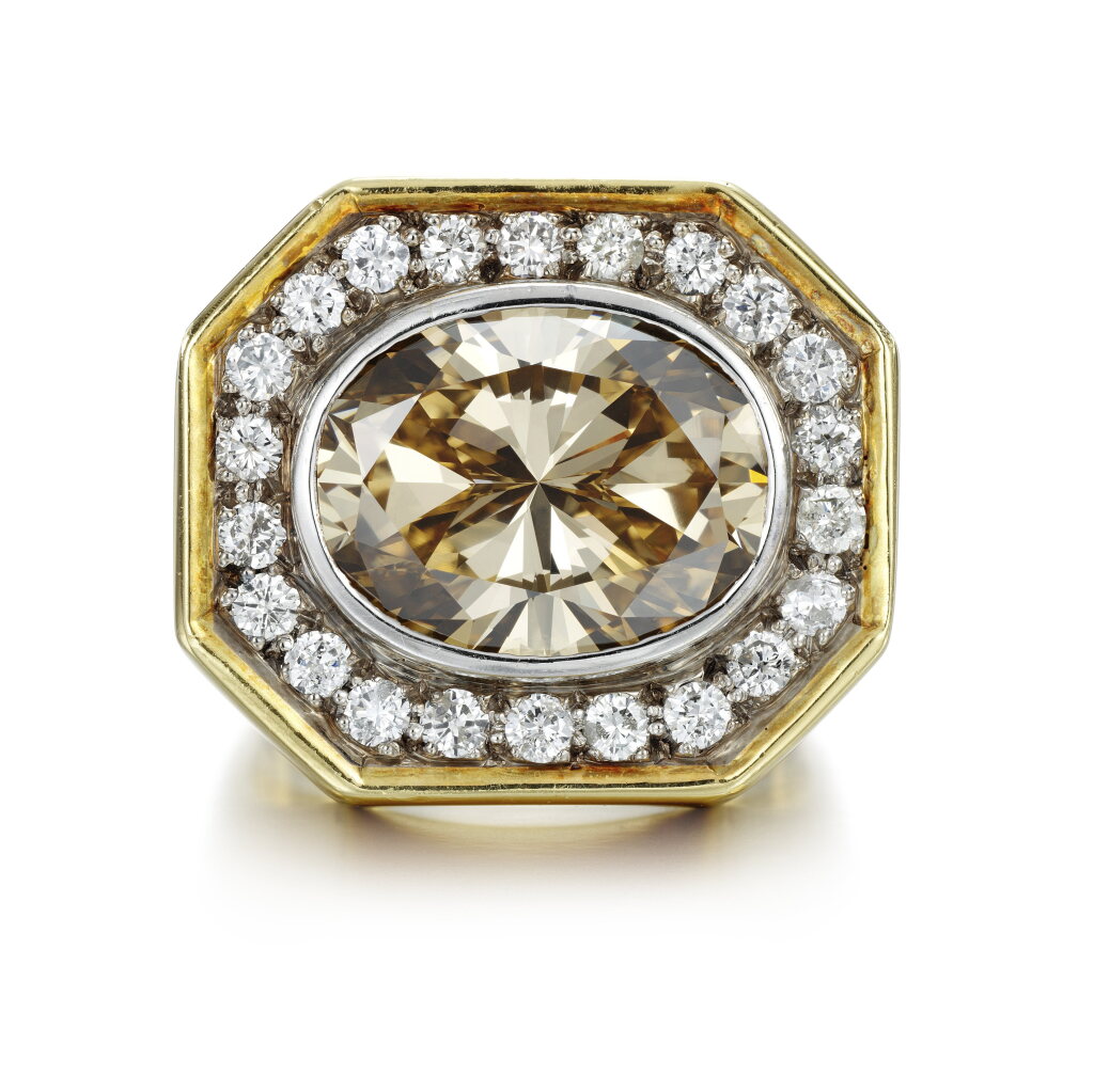 View full screen - View 1 of Lot 33. A fancy light brown Yellow diamond ring.