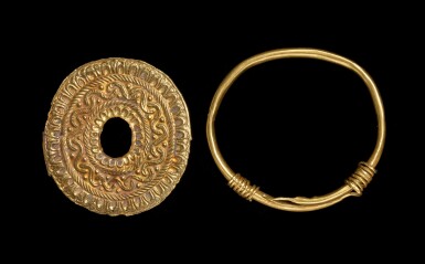 View full screen - View 1 of Lot 6. A Roman Gold Bracelet and Gold Repousse Disc, circa 1st/2nd century A.D..