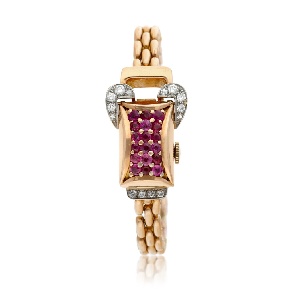 View full screen - View 1 of Lot 163. A pink gold diamond and ruby-set concealed bracelet watch, Circa 1940.