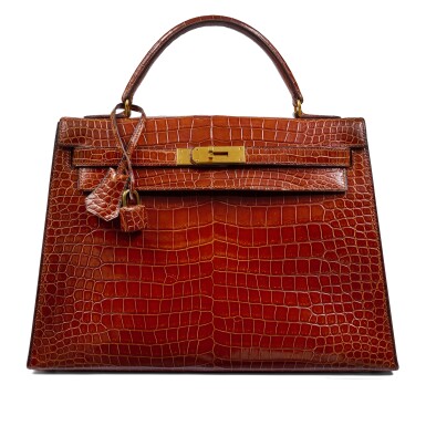 View full screen - View 1 of Lot 56. Vintage Shiny Miel Crocodile Kelly 32 Sellier Gold Hardware, 1981.
