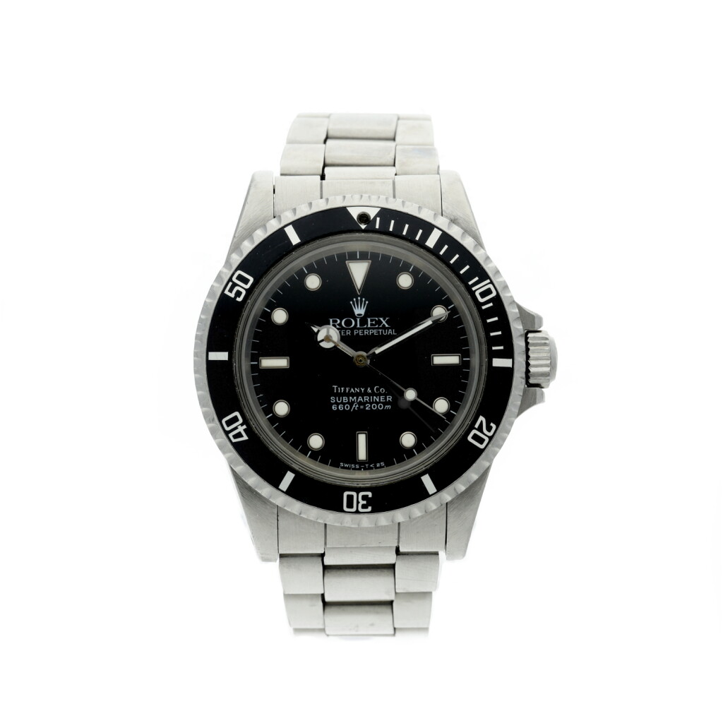View full screen - View 1 of Lot 65. REFERENCE 5513 SUBMARINER RETAILED BY TIFFANY & CO.: A STAINLESS STEEL AUTOMATIC WRISTWATCH WITH BRACELET, CIRCA 1987.
