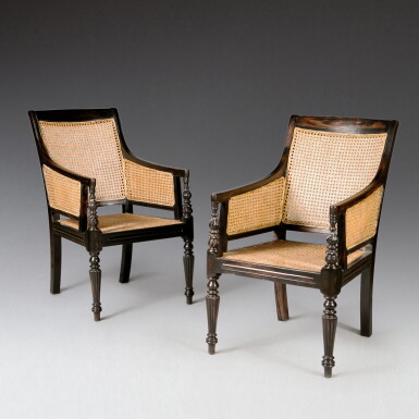 View full screen - View 1 of Lot 156. A pair of Regency style ebony bergères, circa 2000 | Paire de bergères en ébène, style Regency, vers 2000.