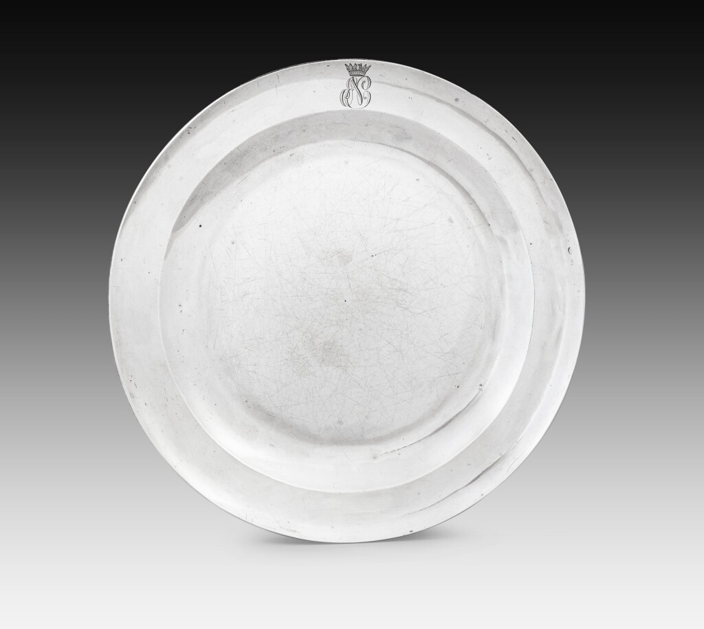 View full screen - View 1 of Lot 91. A French silver plate with the cypher of Prince Eugène de Beauharnais, Martin-Guillaume Biennais, Paris, 1809-1814 Assiette en argent au chiffre du prince Eugène de Beauharnais par Martin-Guillaume Biennais, Paris, 1809-1814.