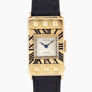 View full screen - View 1 of Lot 95. Retailed by Cartier London: Éclipse Guillotine | A yellow gold and champlevé enamel Art Deco wristwatch with ‘guillotine’ shutters | Circa 1930-31.