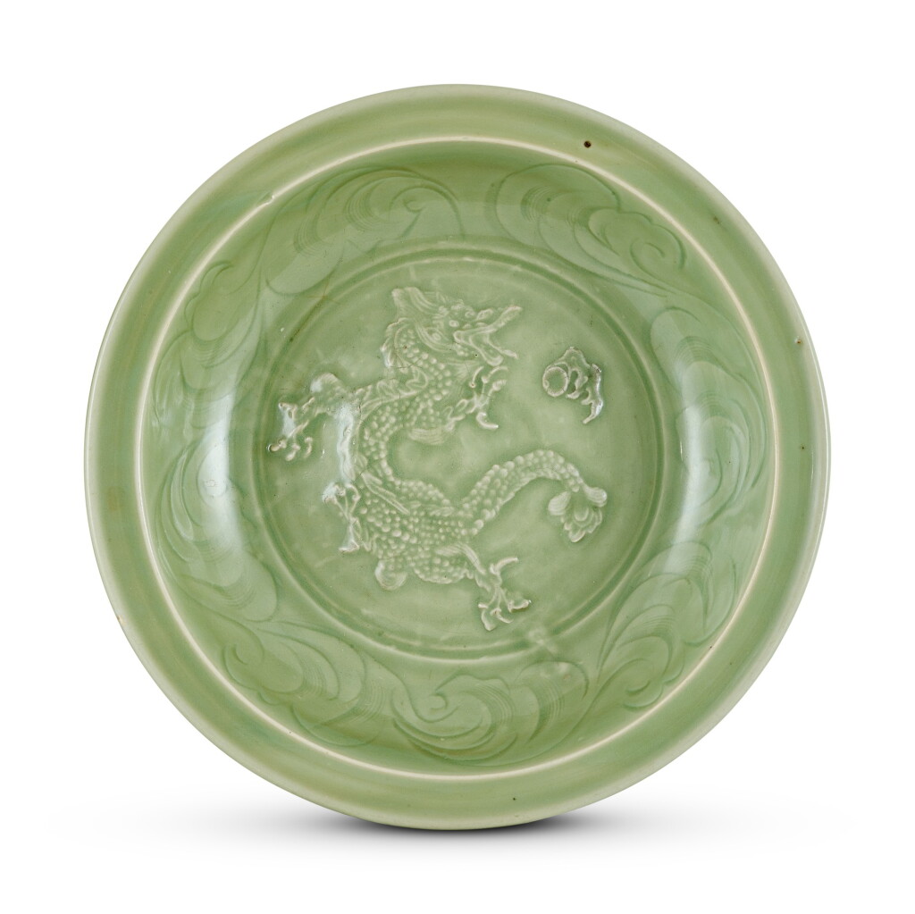 View full screen - View 1 of Lot 5008. A large Longquan celadon 'dragon' dish Yuan dynasty 元 龍泉青釉龍紋折沿盤.