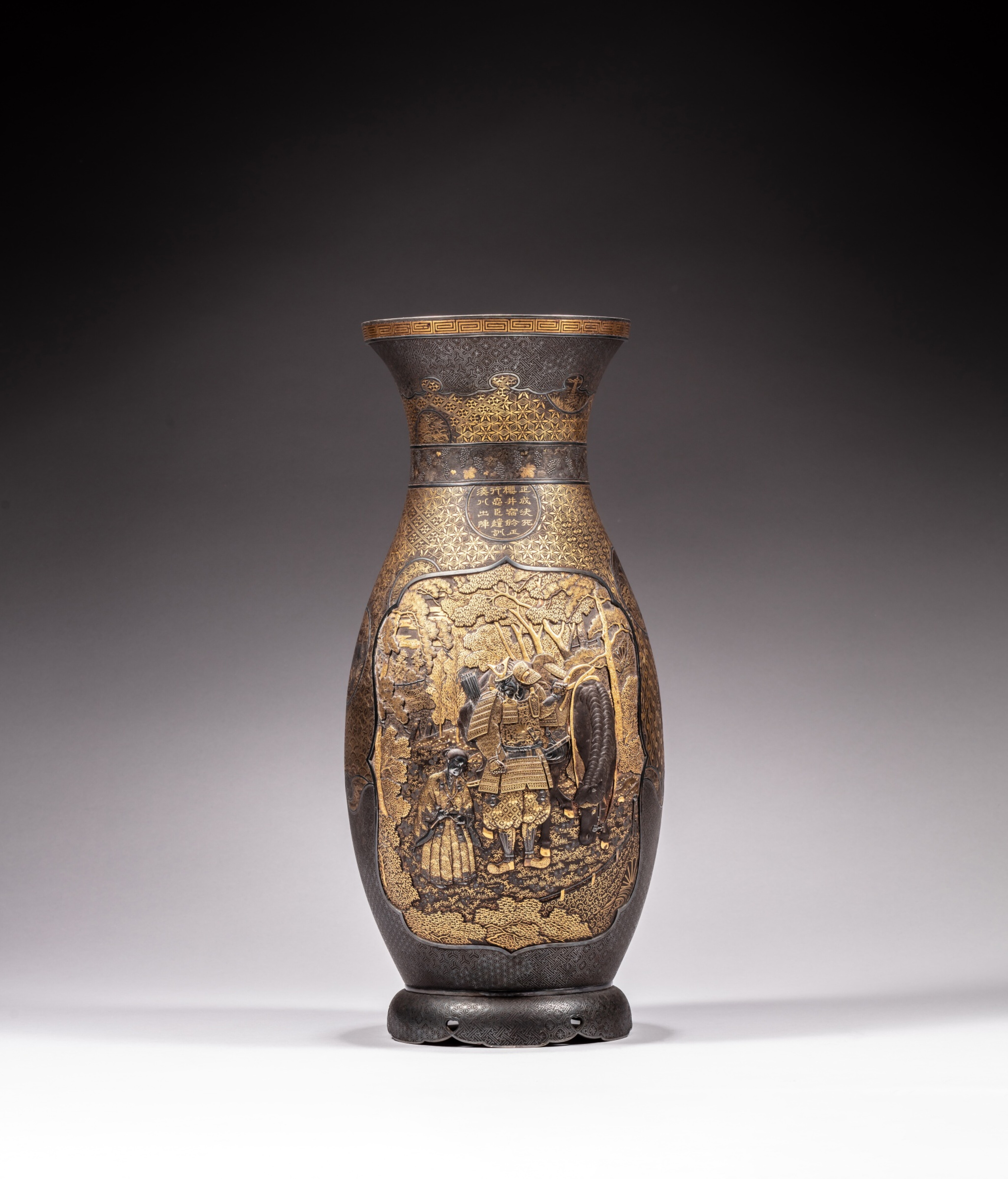 A Komai gilt and silver-inlaid iron 'warrior' vase, signed Kyoto Ju