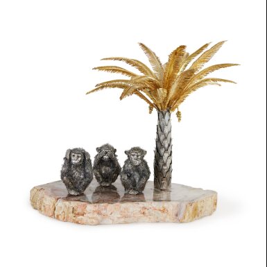 View full screen - View 1 of Lot 463. An Italian Parcel-Gilt Silver Group of Three Monkeys and a Palm Tree on Petrified Tree Base, Mario Buccellati, Florence, 20th Century.