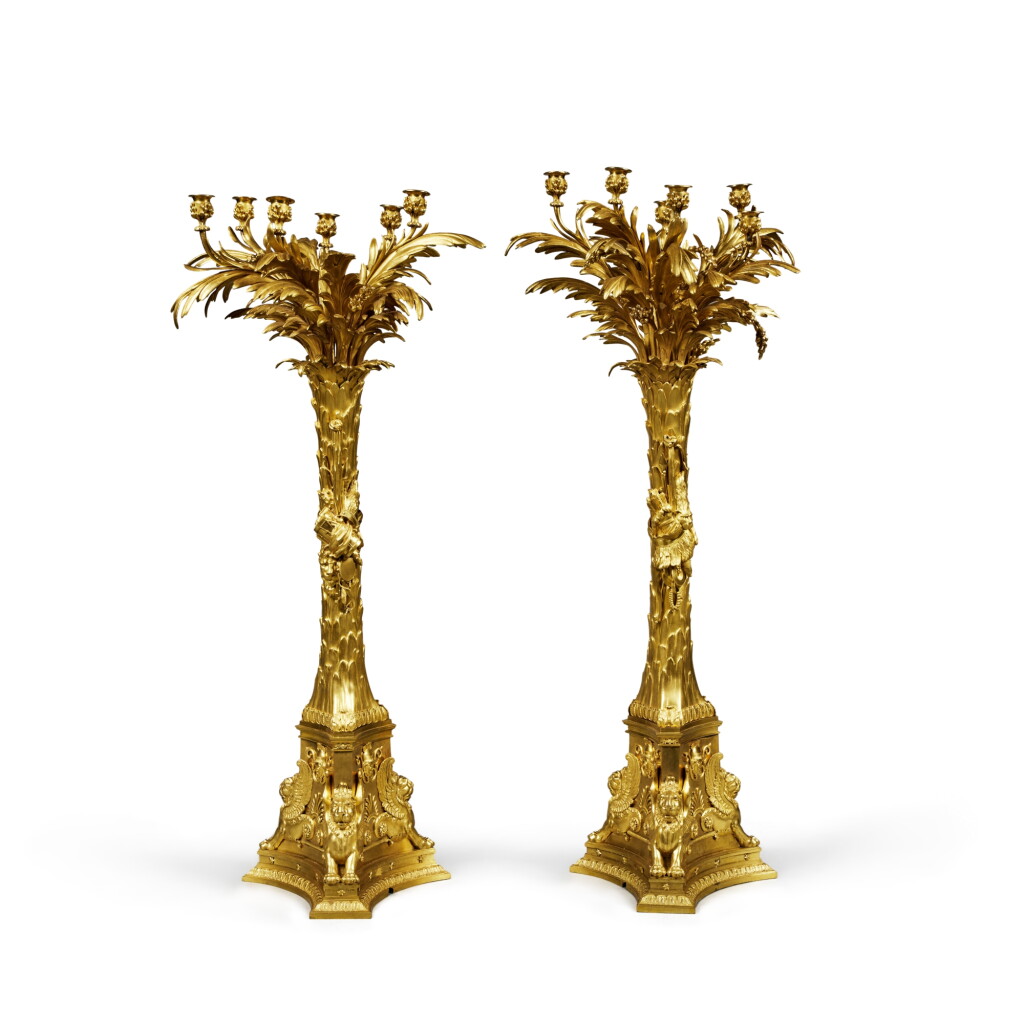 View full screen - View 1 of Lot 149. A Pair of Large Royal German Neoclassical Gilt-Bronze Six-Light Candelabra, most probably made for the Throne Room of the Residential Palace in Darmstadt, probably Berlin, Circa 1810-25, The Design attributed to Karl Friedrich Schinkel .