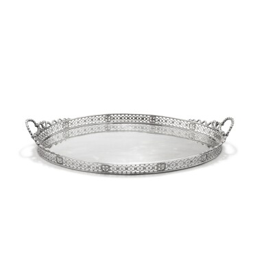 View full screen - View 1 of Lot 99. An oval silver two-handled tray, unidentified marks, probably Portugal circa 1830 | Plateau ovale à deux anses en argent, poinçons non identifiés, probablement Portugal vers 1830.