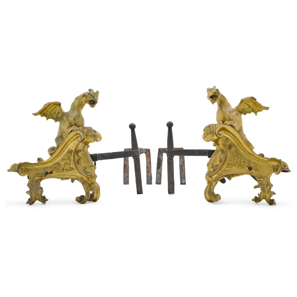 View full screen - View 1 of Lot 23. A pair of Régence gilt-bronze chenets, circa 1745-49.