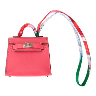 View full screen - View 1 of Lot 141. Rose Lipstick Mini Kelly Twilly Bag Charm of Tadelakt Leather, Silk Twill and Silver Tone Hardware, 2020.