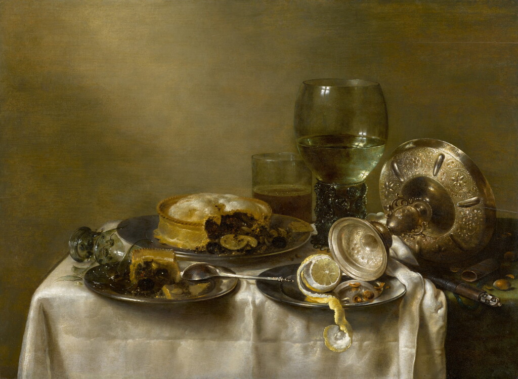 View full screen - View 1 of Lot 11. A still life with an overturned silver tazza, glassware, pies and a peeled lemon on a table |《靜物:桌上倒轉的銀製扁花瓶、玻璃器皿、餡餅和去皮檸檬》.