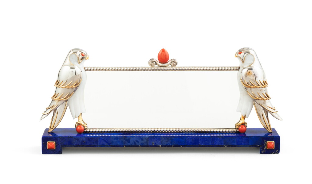 View full screen - View 1 of Lot 31. A large lapis, coral, silver and hardstone photo frame with two hawks, Mellerio, Paris, 2000 | Grand cadre à photo en lapis, corail, argent, pierre dure, à décor de faucons par Mellerio, Paris, 2000.