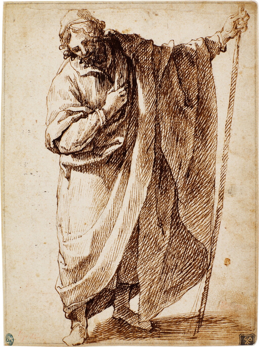 View full screen - View 1 of Lot 75. A standing figure of a man wearing a cloak and holding a stick.