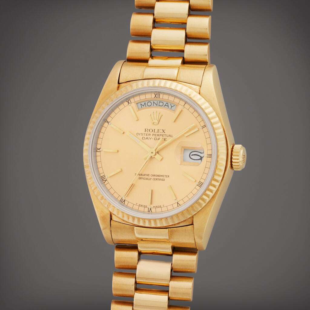 View full screen - View 1 of Lot 16. Reference 18038 Day-Date | A yellow gold automatic wristwatch with day, date and bracelet, Owned by Coach Tom Landry, Circa 1979.