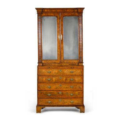 View full screen - View 1 of Lot 32. A George I cross and feather-banded walnut cabinet-on-chest, circa 1725.