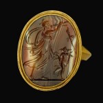 ITALIAN OR SOUTHERN GERMAN, LATE 17TH CENTURY | INTAGLIO WITH A MAENAD PLAYING THE AULOS LED BY A PUTTO HOLDING A TORCH