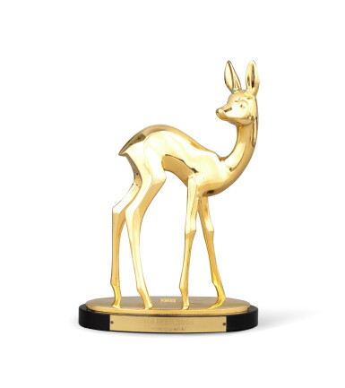 View full screen - View 1 of Lot 2183. A gilt metal trophy "Germany Bambi Madia Awards" 2005, with the name of Karl Lagerfeld | Trophée en métal doré "Germany Bambi Madia Awards" 2005, au nom de Karl Lagerfeld.