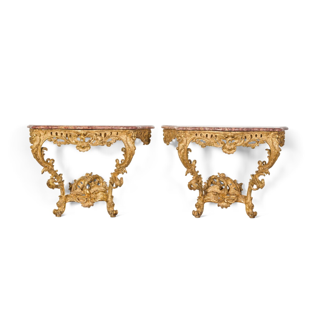 View full screen - View 1 of Lot 102. A pair of Louis XV carved giltwood console tables, mid-18th century.