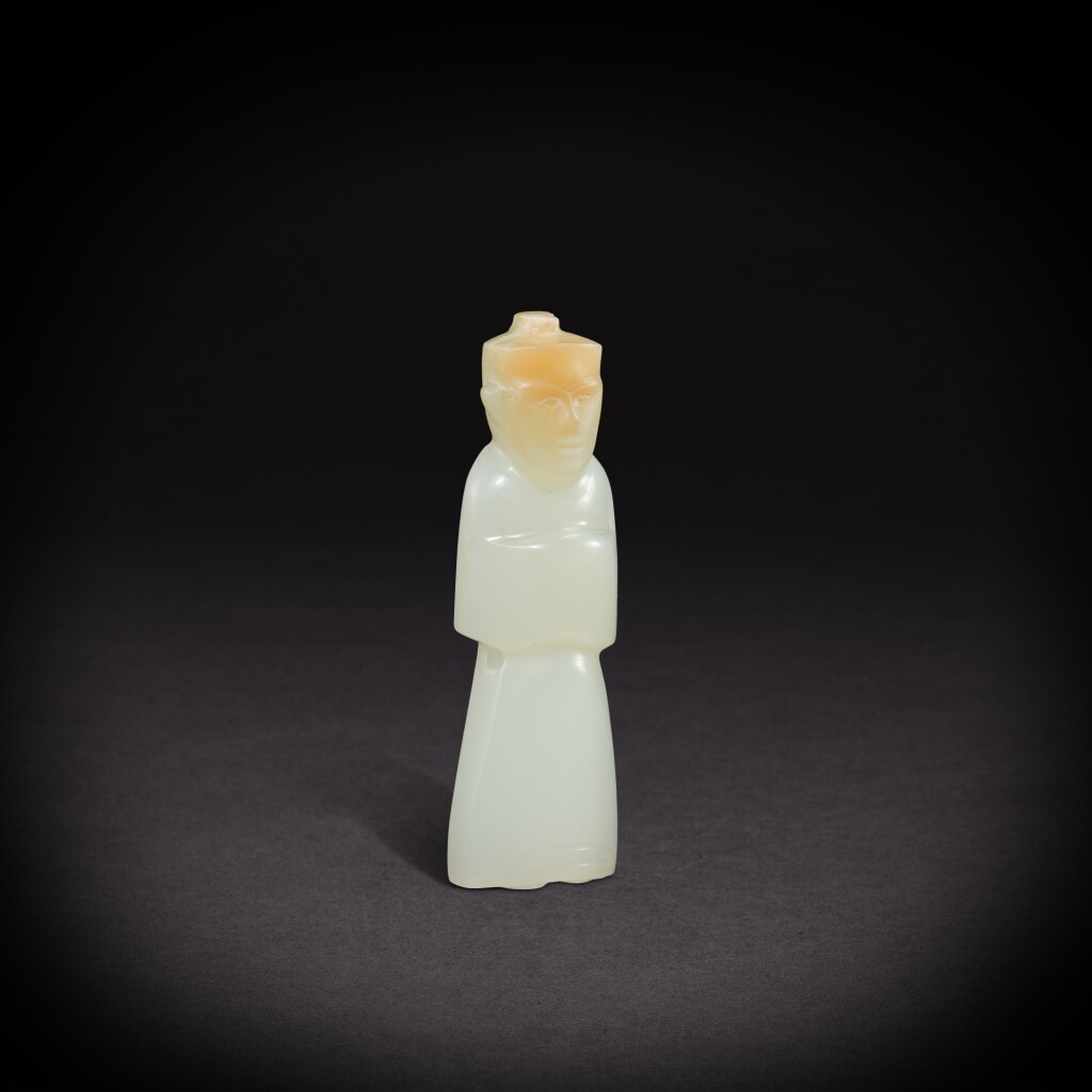 View full screen - View 1 of Lot 6842. A white and russet jade figure, wengzhong, Han dynasty | 漢 白玉翁仲.
