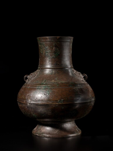 View full screen - View 1 of Lot 802. An inscribed archaistic bronze vessel (hu), Qing dynasty | 清 銅鋪首耳壺.
