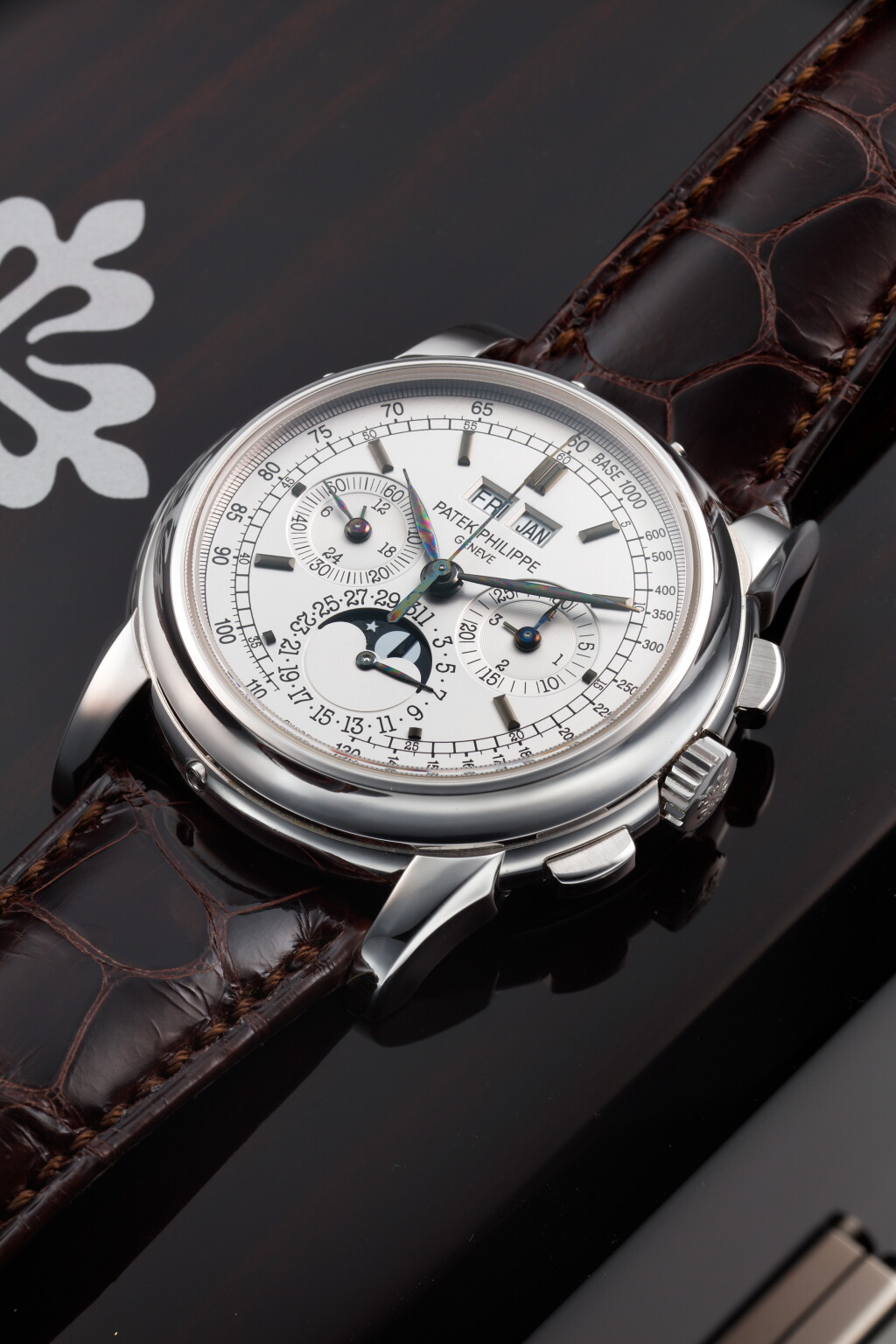View full screen - View 1 of Lot 175. REFERENCE 5970G-001 A WHITE GOLD PERPETUAL CALENDAR CHRONOGRAPH WRISTWATCH WITH MOON PHASES, 24 HOURS AND LEAP YEAR INDICATION, CIRCA 2005.
