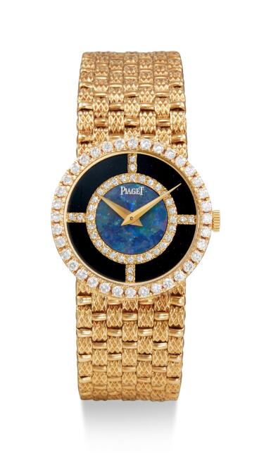 View full screen - View 1 of Lot 8085. PIAGET | REFERENCE 9706, D 23 A YELLOW GOLD AND DIAMOND-SET BRACELET WATCH WITH OPAL AND ONYX DIAL, CIRCA 1990.