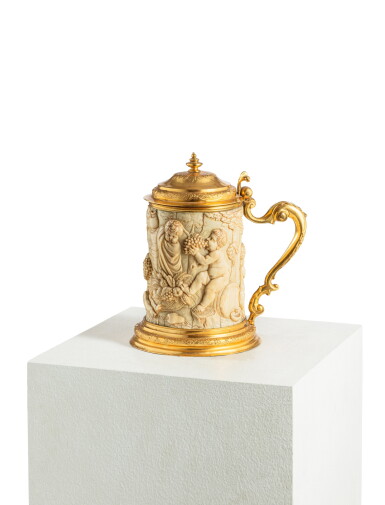 View full screen - View 1 of Lot 77. A German metal-gilt mounted ivory tankard, late 19th century .