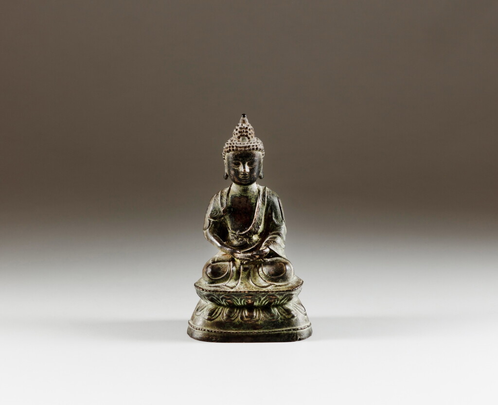 View full screen - View 1 of Lot 190. A bronze seated figure of Buddha, late Ming dynasty | 明末 銅佛坐像.