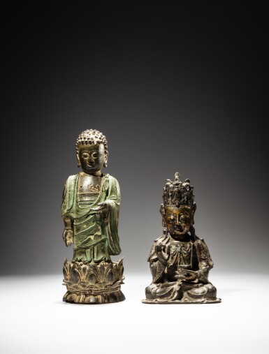 View full screen - View 1 of Lot 103. A parcel-gilt bronze figure of seated Guanyin, Ming dynasty, and a bronze figure of a standing Buddha, Qing dynasty, 18th century | 明 局部鎏金銅觀音坐像 及 清十八世紀 銅佛立像.