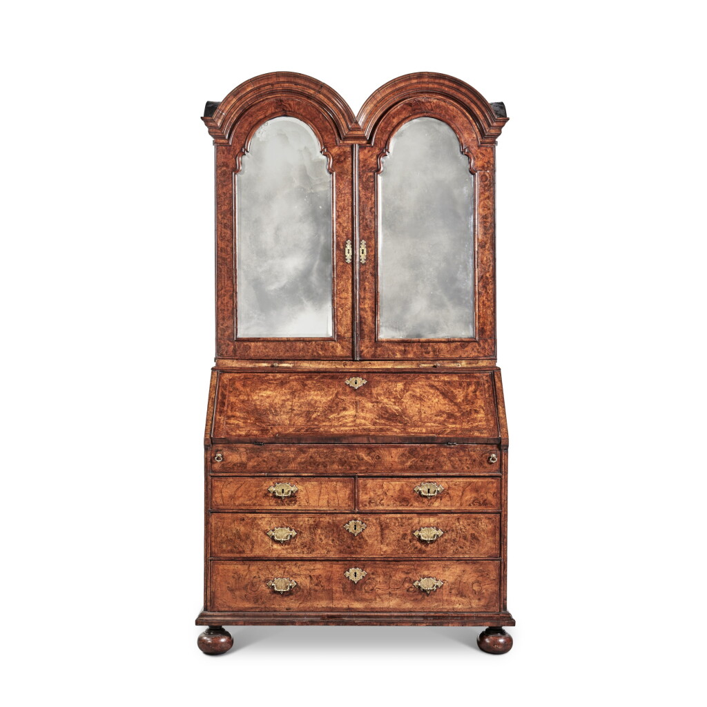 View full screen - View 1 of Lot 8. A George I Figured and Burr Walnut and Stained Field Maple Double Dome Bureau Cabinet, Circa 1715.