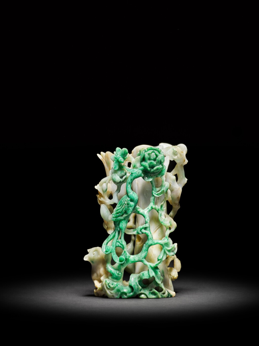 View full screen - View 1 of Lot 28. A carved jadeite 'phoenix and peony' vase, Qing dynasty, 19th century | 清十九世紀 翠玉浮雕鳳凰牡丹紋花插.