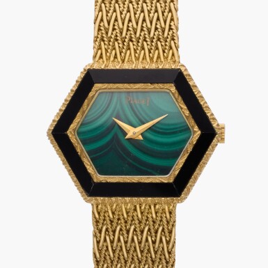 View full screen - View 1 of Lot 574. Reference 9553 D11 | A yellow gold and onyx bracelet watch with malachite dial, Circa 1970.