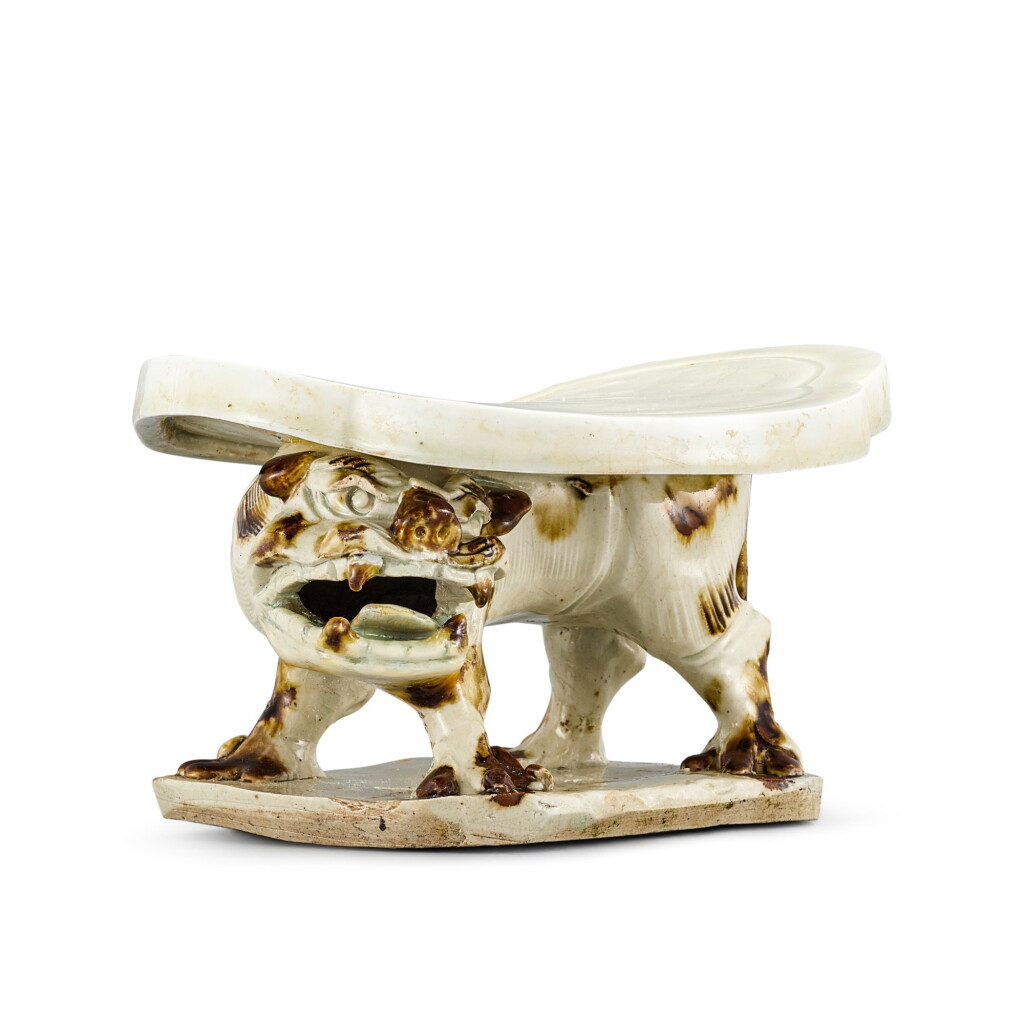 View full screen - View 1 of Lot 428. A rare qingbai brown-splashed 'lion' pillow Northern Song dynasty | 北宋 青白釉褐斑獅形枕.